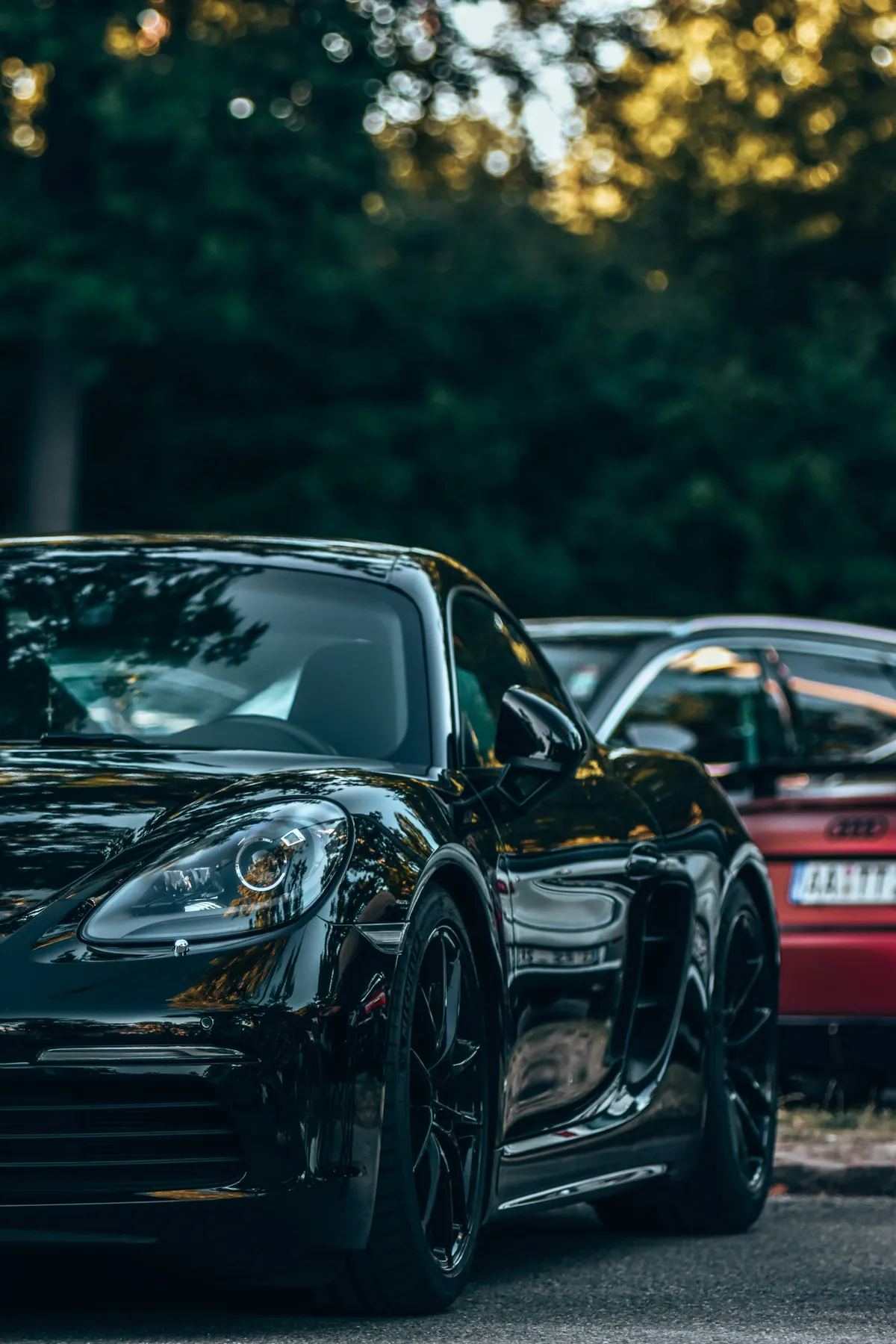 A black Porsche 718 Cayman